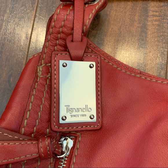 Tignanello Handbags - Tignanello red leather purse. Good condition!